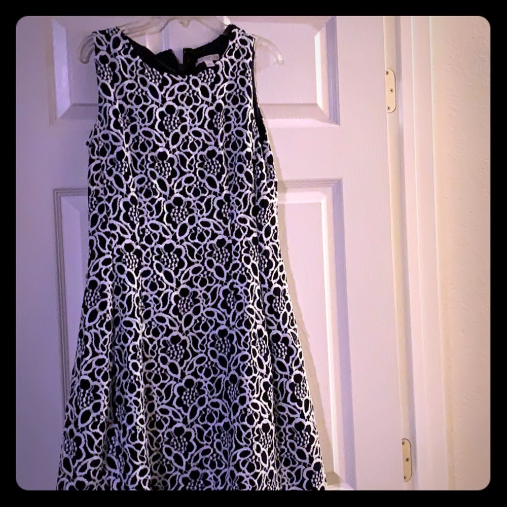 Knee length navy blue with white crochet overlay.